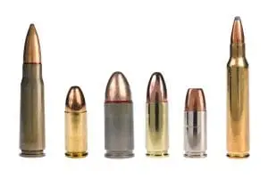 Different handgun and rifle cartridges displayed side by side for size comparison