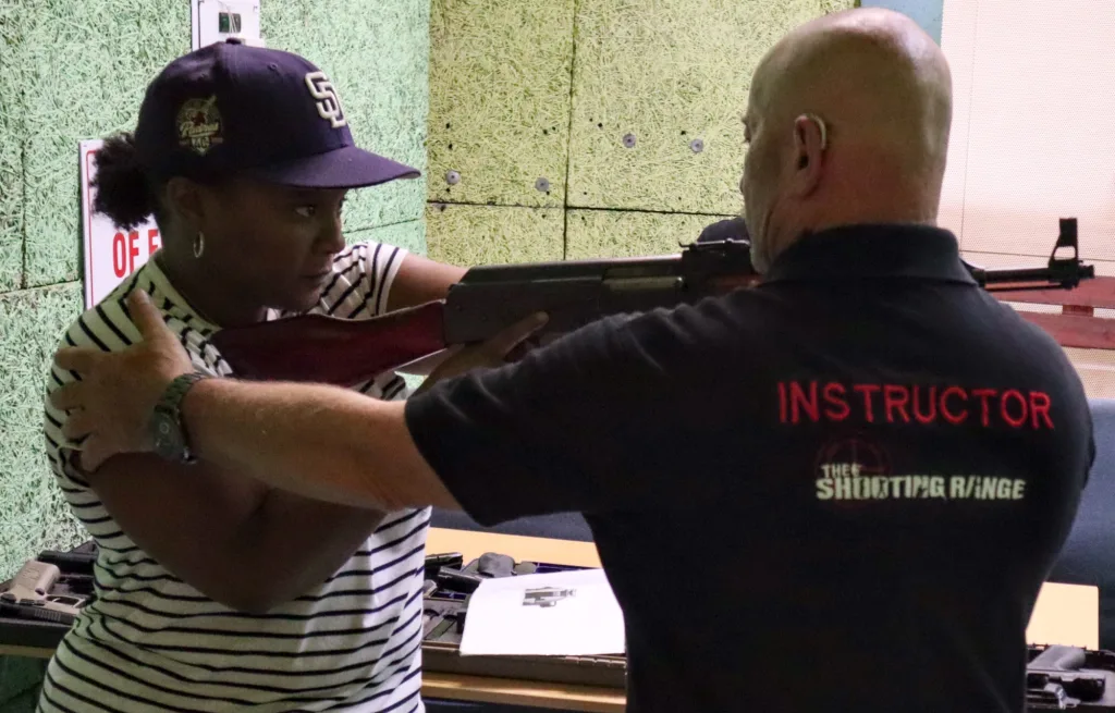 Instructor guiding student during firearm competency training at The Shooting Range Johannesburg